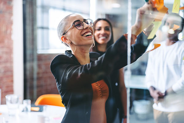 Smiling businesswoman sharing her ideas with her colleagues